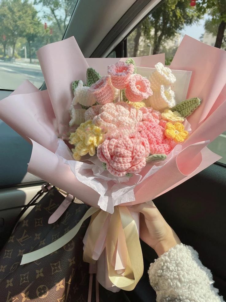 a bouquet of flowers in the back seat of a car