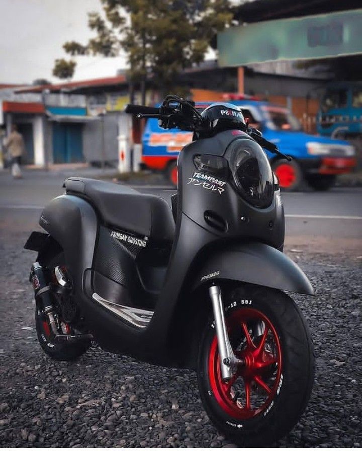 a black and red motorcycle parked on the street