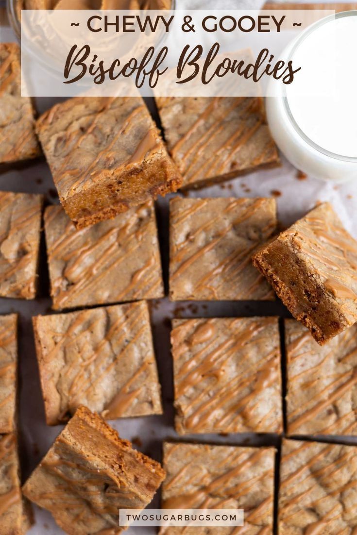 chewy and gooey biscuit blondies with a glass of milk in the background