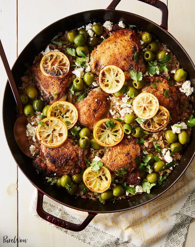 chicken and olives with rice in a skillet