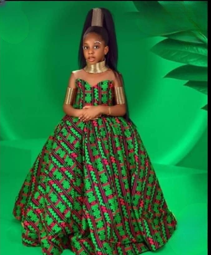 Searching for a bespoke beautiful African Girl Dress for your daughter's birthday, pageant, graduation and other social events? Search no more, you are at the right place.  This dress is beautifully handcrafted from the best of 100% African print fabric that can stand the test of time by our team of professional and experienced seamstresses. It is meticulously sewed with precision and attention to detail, ensuring a perfect fit and impeccable finish.  Ordering Process Kindly swipe left of the product picture to see pictures of available fabrics and sizes. Then select the number that corresponds to your fabric of choice and size from the fabric and size options before proceeding to payment. If need be, please measure and send her (Chest, Waist and Dress Length) measurement. It is a custom o Girls Ball Gown, African Princess, African Dresses For Kids, African Children, Dress African, African Girl, African Print Dress, African Design Dresses