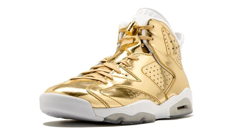 The classic Air Jordan 6  silhouette receives the "P1NNACLE" treatment.  Taking a walk on the luxe side, its upper is coated in metallic gold monochromatic patent leather.   An offsetting white midsole and heel tab break the monotony.  A metallic gold specked outsole and oversized Jumpman hangtag are interesting touches that round out the sneaker. Air Jordan 6 Retro, Nike Air Jordan 6, Jordan 6 Retro, Taking A Walk, Air Jordan 5 Retro, Air Jordan 6, Stadium Goods, Jordan 6, Air Jordan 11