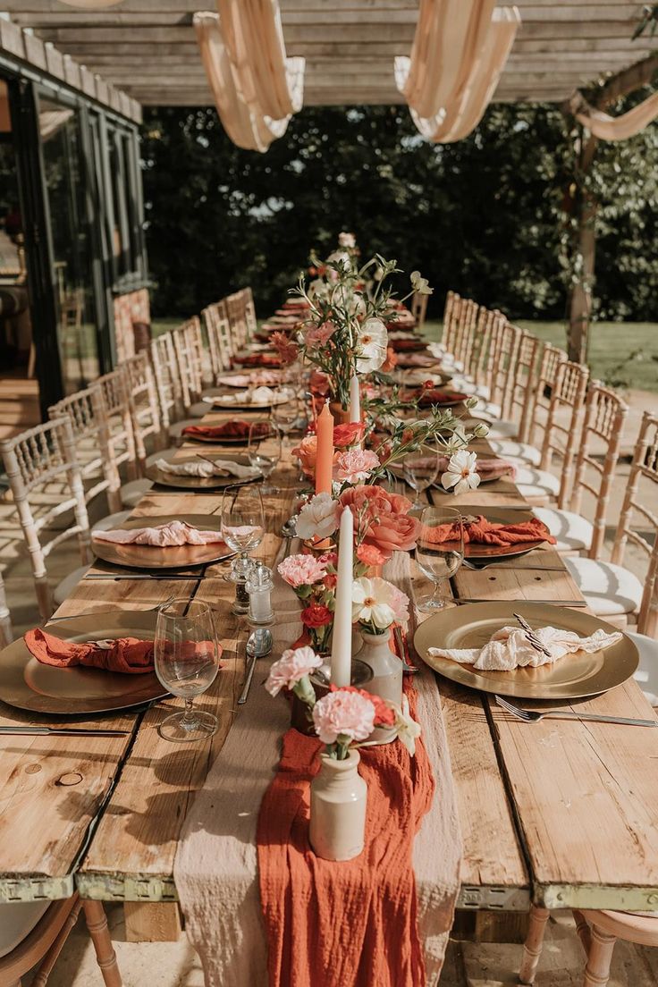 a long table set with plates and place settings