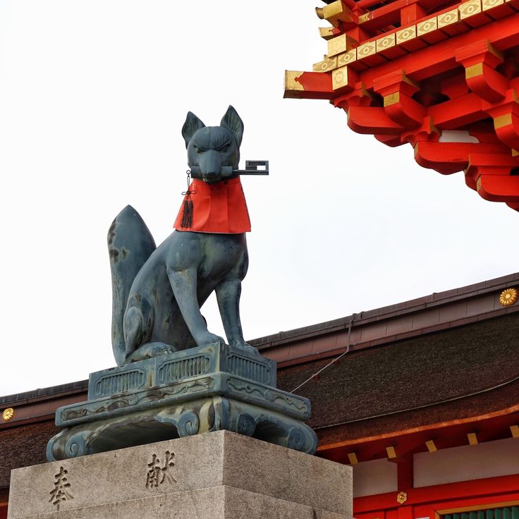 a statue of a dog on top of a building