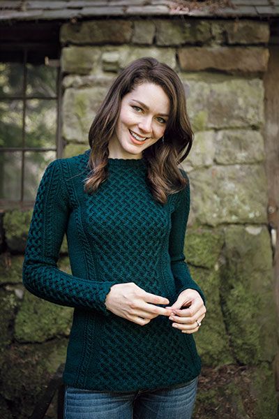 the cover of heartwood magazine featuring a smiling woman in a green sweater and jeans