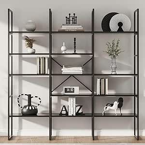 a book shelf with books and vases on it in an empty room next to a white wall