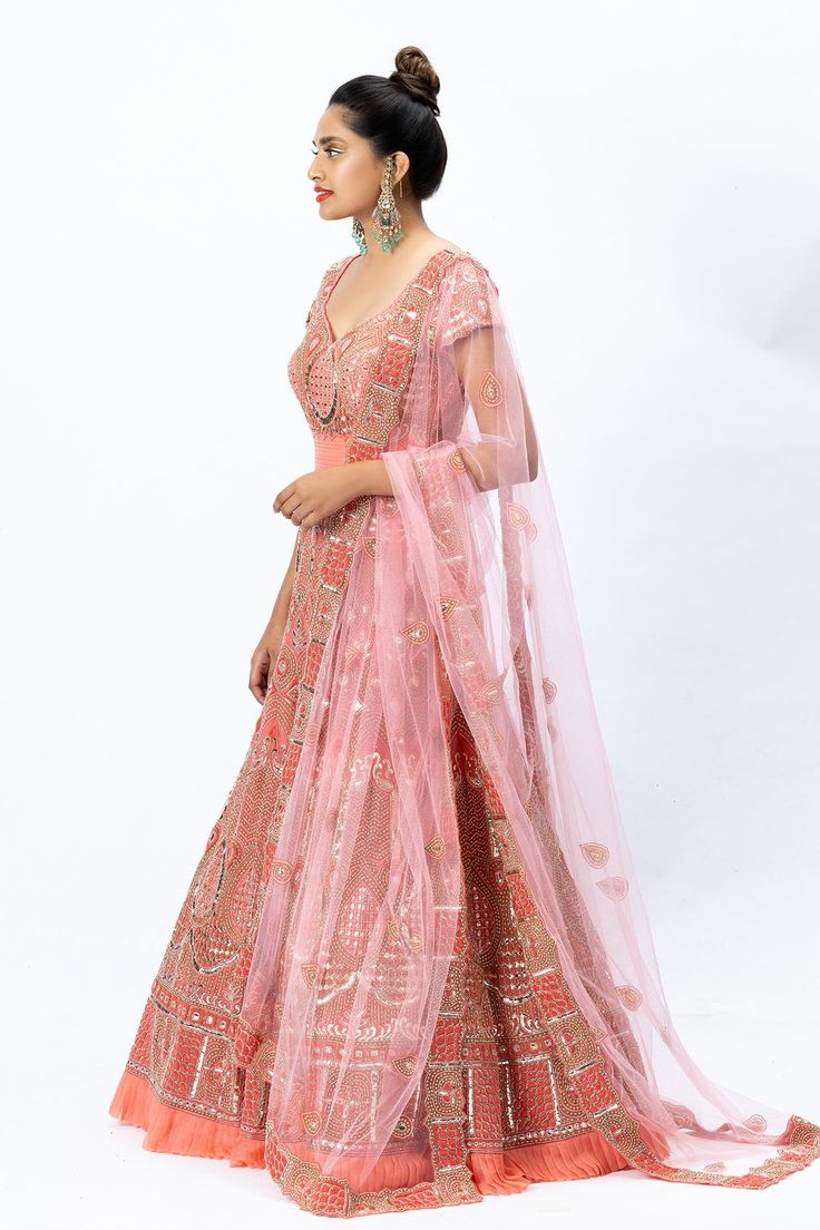 Coral pink anarkali with hand embroidered motifs and pleated hem. Comes with a sheer embroidered dupatta and churidar.
Component: 3
Pattern: Embroidered
Neckline: Leaf neck
Sleeve Type: Half sleeves
Fabric: Organza, Nokia Silk, Tulle
Color: Pink
Other Details: 
U-back
Pleated hem
Sheer dupatta
Embroidered motifs
Occasion: Bride, Wedding - Aza Fashions Pink Tissue Silk Anarkali Set With Zari Work, Traditional Pink Tissue Silk Anarkali Set, Transitional Dupatta With Resham Embroidery For Reception, Pink Resham Embroidery Dupatta For Reception, Pink Tissue Silk Salwar Kameez For Reception, Pink Tissue Silk Anarkali Set For Diwali, Pink Dori Work Dupatta For Reception, Anarkali Set With Zari Work For Reception, Semi-stitched Anarkali Set With Dupatta For Reception