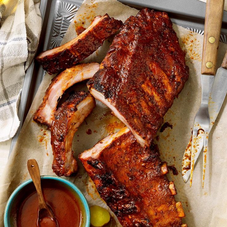 the ribs are ready to be cooked and served with dipping sauces on the side