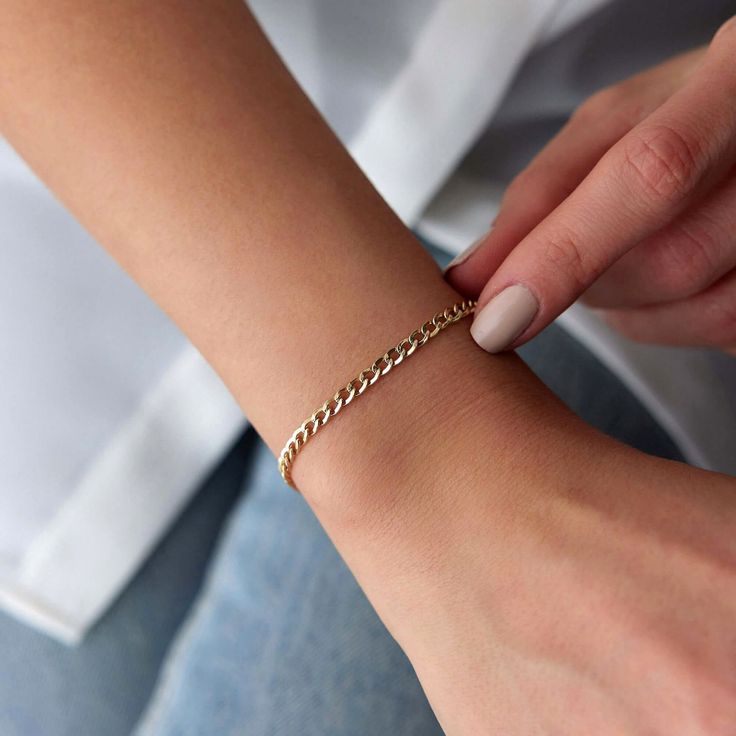 Our very simple and elegant plain chain bracelet. This chain bracelet is ideal for minimalists. Because we craft our pieces with real 14k solid gold, you can enjoy this delicate piece with a free mind every day. Our elegant bracelet is crafted with real 14k solid gold(not plated, not vermeil, not gold filled) The bracelet measure 3. 2 mm in width Since we work with real gold, you can enjoy this piece with a free mind without the worry of water, conditioner or alcohol contact. Real gold keeps its Minimalist Gold Cuban Link Bracelet For Everyday, Elegant Everyday Cuban Link Bracelet With Adjustable Chain, Dainty 14k Gold Jubilee Chain Bracelet, Minimalist Tarnish Resistant Sterling Silver Bracelet, Minimalist Charm Bracelet With Delicate Link Chain, Minimalist Cuban Link Bracelet For Everyday, Minimalist Link Charm Bracelet With Delicate Chain, Everyday Minimalist Cuban Link Bracelet, Minimalist Cuban Link Bracelet