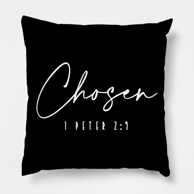 a black pillow with the word chosen written in cursive writing on it, against a white background