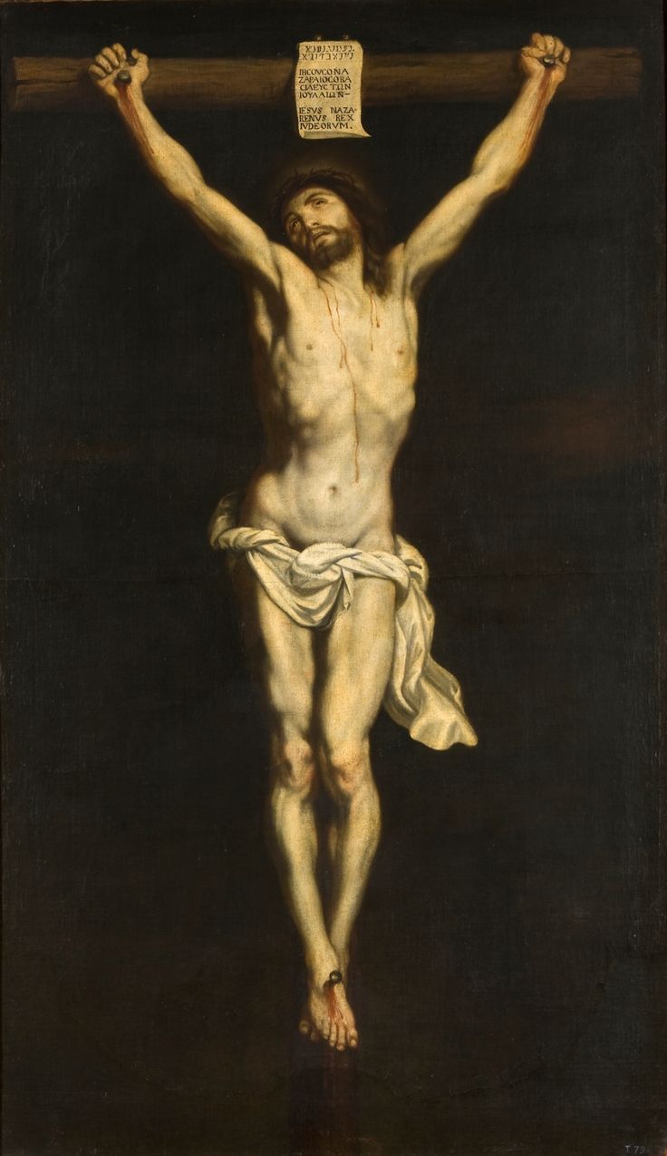 the crucifix is painted in black and white with a paper on it