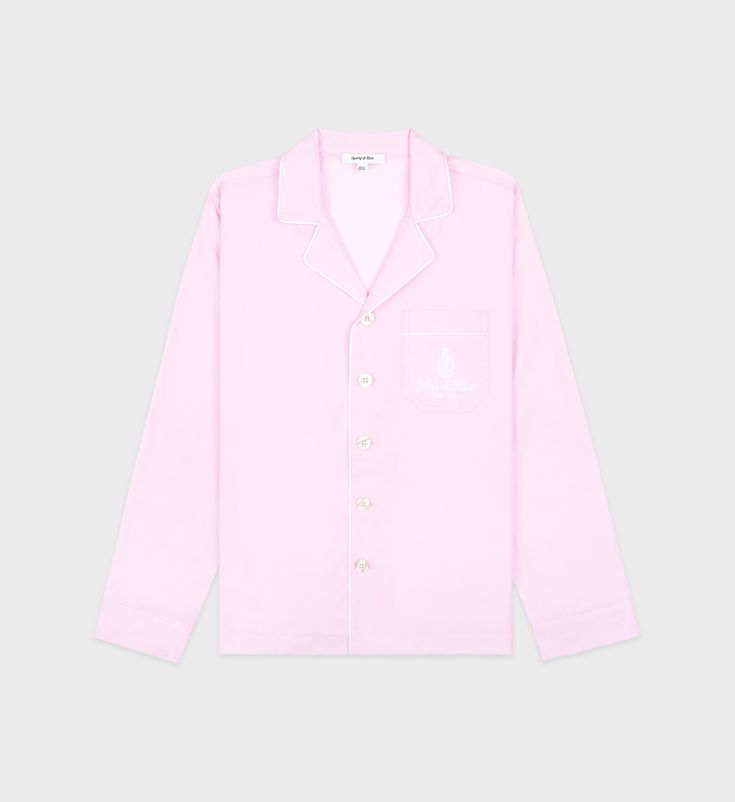 Made from 100% cotton poplin. Our Pyjama shirts are made in Portugal at one of the finest and oldest European shirt maker. Regular fit with a spread collar, straight hem and buttoned cuffs. - 100% Cotton- Mother of pearl buttons - Made in Portugal- 1 Chest pocket- Embroidered logo Long Sleeve Cotton Dress Shirt For Daywear, Cotton Long Sleeve Dress Shirt For Daywear, Classic Cotton Shirt For Loungewear, Cotton Shirt With Spread Collar For Loungewear, Cotton Shirt With Button Cuffs For Loungewear, Classic Relaxed Fit Shirt For Loungewear, Cotton Dress Shirt With Relaxed Fit And Spread Collar, Pink Cotton Dress Shirt With Spread Collar, Collared Cotton Shirt For Loungewear