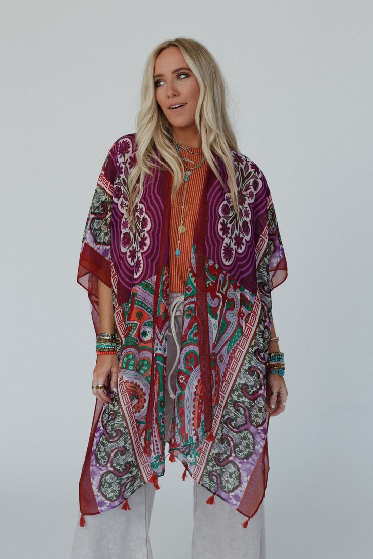 You'll add a stunning addition to your boho wardrobe with our Tabitha Floral Kimono, sure to become a cherished piece in your collection, adding a touch of bohemian glamour to every occasion! You'll love layering with this eye-catching kimono becasue it features: Lightweight, woven, slightly sheer fabric with a so pretty print throughout Relaxed and loose kimono silhouette Classic open front closure Loose kimono style sleeves and side slits created by single side seams So cute tassel details alo Festive Bohemian Kaftan With Floral Print, Bohemian Printed Kimono For Beach Cover-up, Red One-size Kimono For Festivals, Bohemian Kimono With Boho Print For Beach Cover-up, Bohemian Festive Kaftan, Festive Floral Print Kimono, Boho Print Kimono For Beach In Fall, Bohemian Floral Print Kimono, Fall Beach Kimono With Boho Print