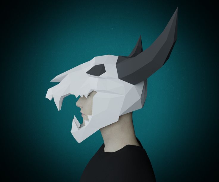 a paper mask with an animal's head cut out to look like a demon