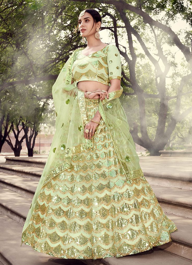 Pista Green Sequence Lehenga Choli Fitted Pista Green Sharara With Cutdana, Pista Green Fitted Sharara With Cutdana, Pista Green Palazzo Set For Reception And Festivals, Pista Green Sets For Reception Navratri, Pista Green Sets For Reception And Navratri, Pista Green Sets For Reception During Navratri, Floor-length Pista Green Palazzo Set For Wedding, Pista Green Gown With Cutdana Detailing, Pista Green Gown With Cutdana