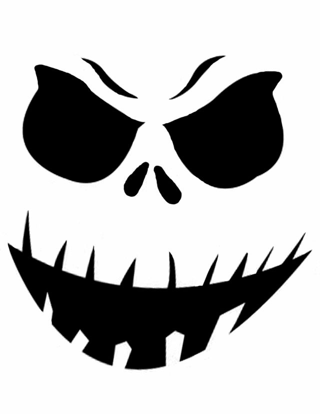 a black and white image of an evil face with fangs on it's eyes