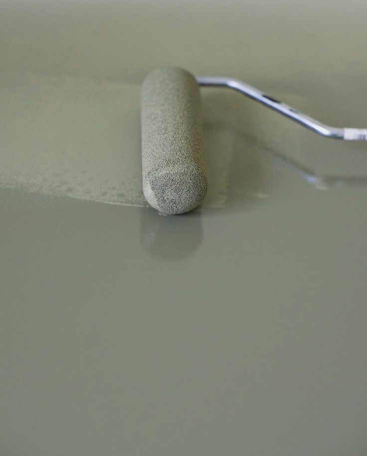 a toothbrush sitting on top of a table next to a white object with a metal handle