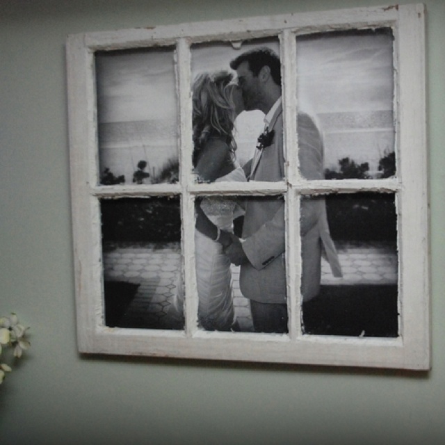 an image of a couple kissing in front of a window with the caption easy home ideas large photo in an old window pane