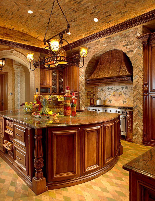 a large kitchen with wooden cabinets and an island in front of a stove top oven