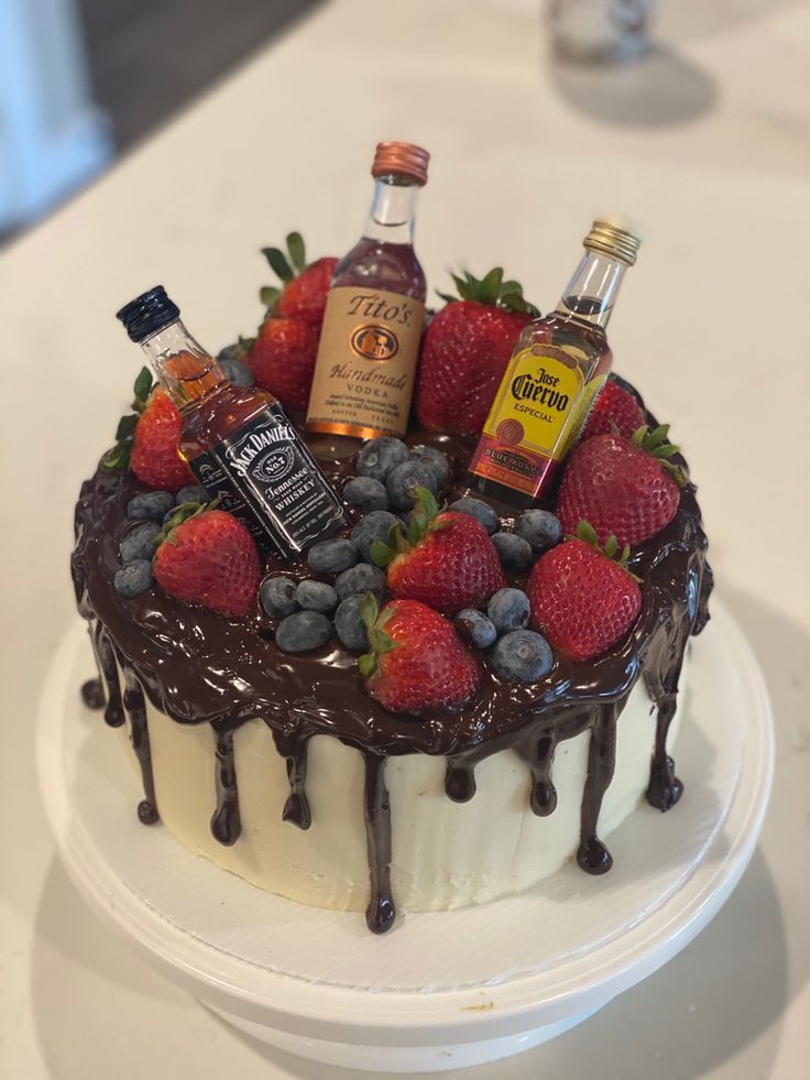 a chocolate cake with fruit and liquor on top