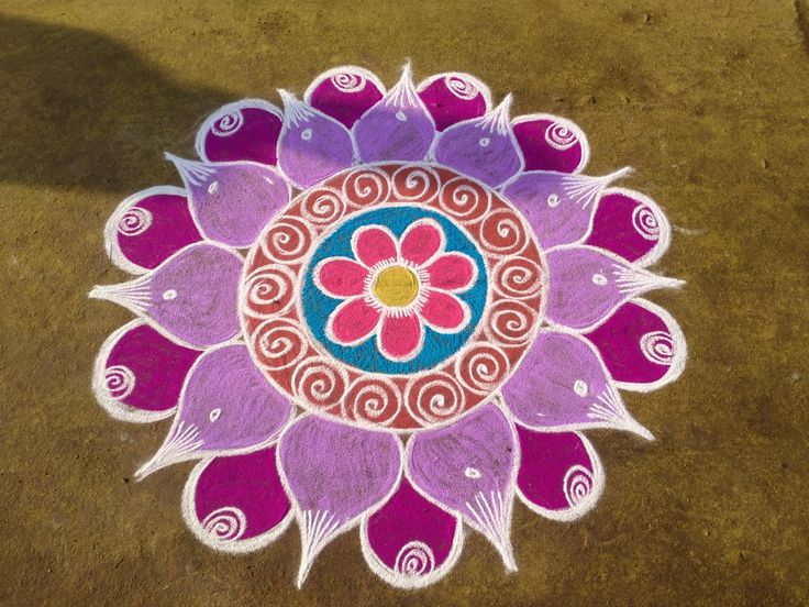 a colorful flower design on the ground