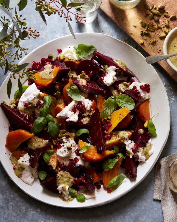 a white plate topped with beets and feta cheese