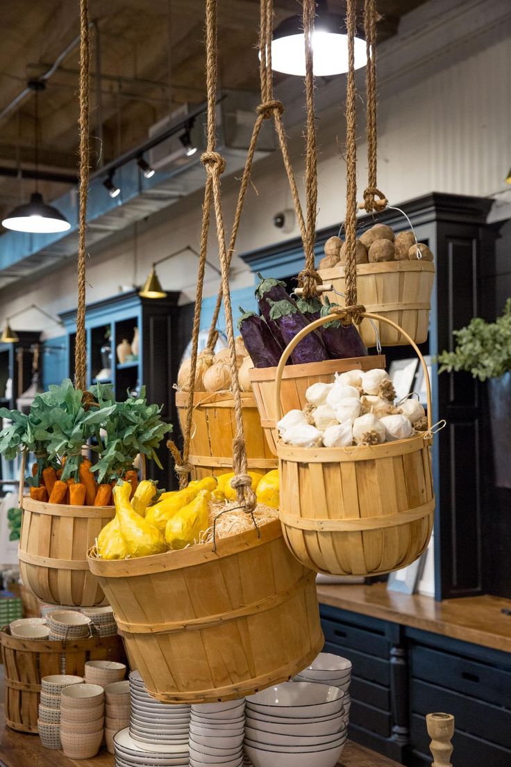 baskets filled with vegetables hanging from hooks