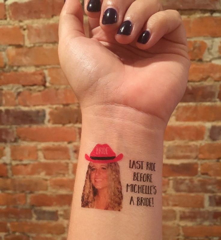 a woman with a red hat on her wrist