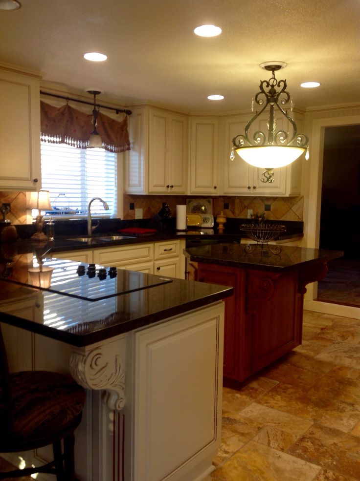 a large kitchen with an island in the middle