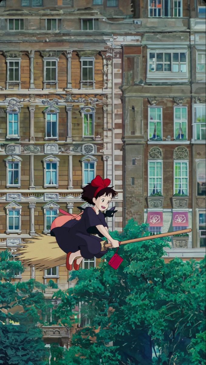 a woman flying through the air while riding on top of a broom in front of a tall building