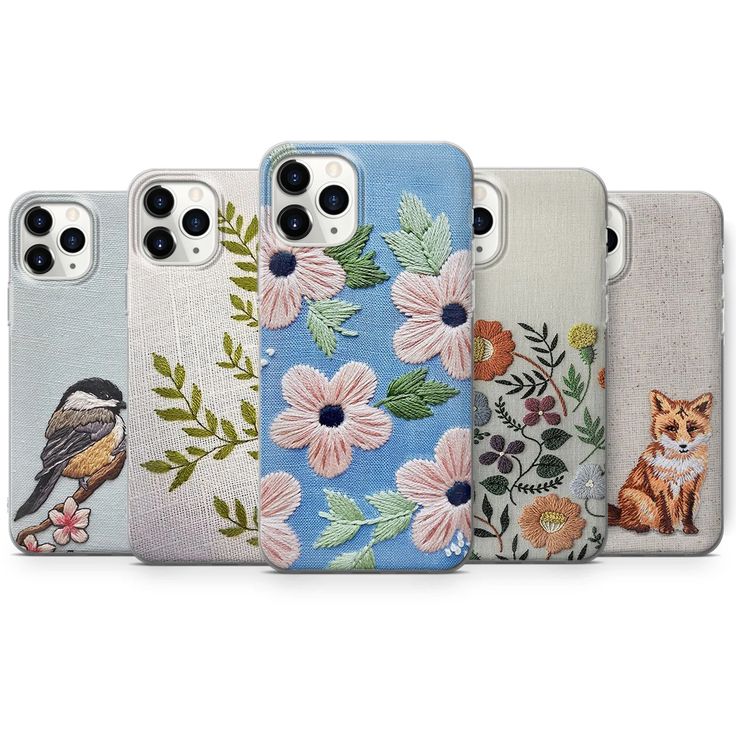 four cases with flowers and birds on them, one has a phone case in the shape of an iphone