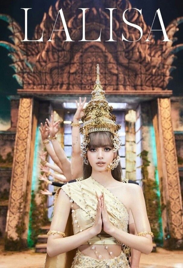 a woman in a gold dress with her hands together and the words lalisa above her head