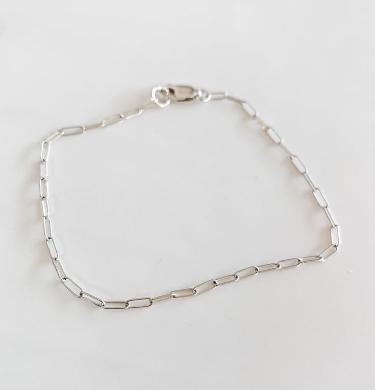 The most beautiful dainty Jenni mini silver paperclip chain! sterling silver Classic Silver Chain Bracelet For Everyday, Sterling Silver Delicate Chain Bracelet For Everyday, Everyday Sterling Silver Delicate Chain Bracelet, Classic Silver Chain Paperclip Bracelet With Oval Links, Classic Silver Paperclip Bracelet With Oval Links, Classic Paperclip Bracelet With Oval Link Silver Chain, Sterling Silver Bracelet With Silver Chain For Everyday Wear, Elegant Silver Chain Paperclip Bracelet As Gift, Everyday Chain Bracelet With Rectangular Links