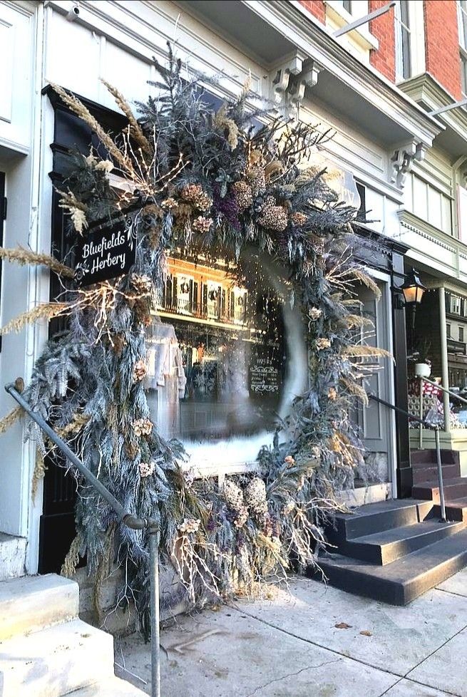 a christmas wreath on the side of a building