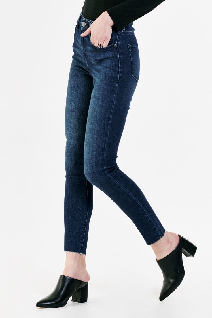 Super high rise ankle skinny jeans. It's the flirty fit that sits at the natural waist and fitted skinny in the hips through the leg. Ankle inseam on comfort stretch denim accented with back "X" belt loop, handsanding hip whiskers, tonal navy stitching, cut-off hem details.10 1/2" Front Rise (include waistband), 10" Leg Opening, 28" inseam (Size 27) 92% COTTON 6% RECYCLED POLYESTER 2% SPANDEX Machine wash cold, Tumble dry low Imported Zip fly and button closure Five-pocket style Dark Wash Stretch Cropped Jeans With Frayed Hem, Stretch Cropped Jeans With Frayed Hem In Dark Wash, Fall Medium Wash Mid-rise Jeggings, Stretch Jeans With Frayed Hem In Dark Wash, Stretch Dark Wash Jeans With Frayed Hem, Mid-rise Medium Wash Jeggings For Fall, Fall Mid-rise Medium Wash Jeggings, Stretch Mid-rise Cropped Jeans With Frayed Hem, Dark Wash Mid-rise Cropped Jeans With Frayed Hem