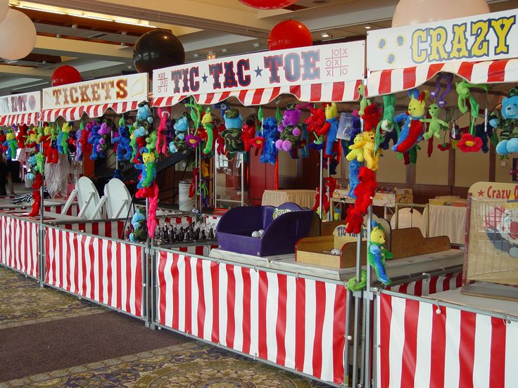 a carnival booth with many items for sale