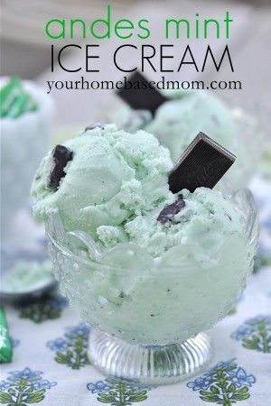 an ice cream sundae with mint and oreo cookies on top, in a glass bowl