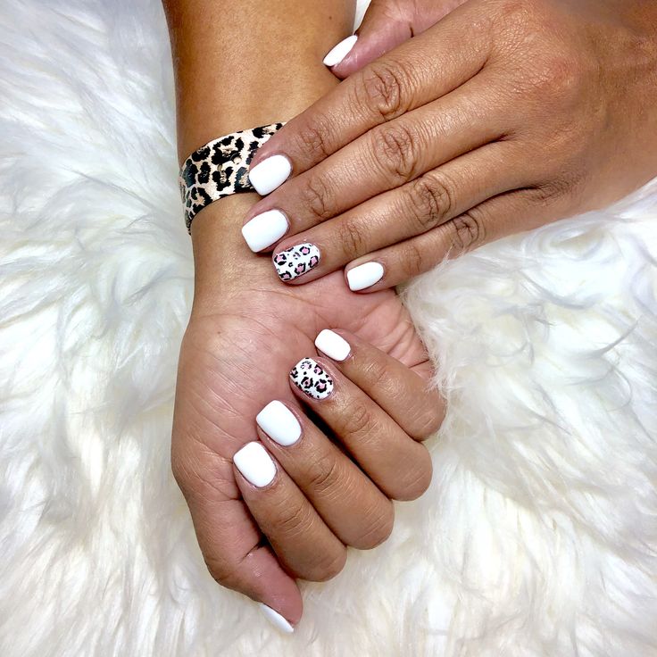 I love my new mani! So fresh for summer with a little accent! I use SNS clear dip and finish with a gel/shellac. Lasts three weeks! White: (DND Alpine Snow) Dip nails, gel nails, acrylic nails, nail designs, leopard nails, summer nails, white nails White Dip Nails With Accent Nail, White Nails With Leopard Print, White Sns Nails With Designs, White And Cheetah Nails, White Nails With Cheetah Print, White And Leopard Nails, Short White Gel Nails With Design, White Dip Nails With Designs, White Nails With Designs Summer