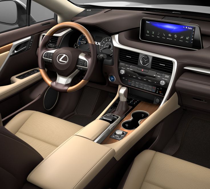 the interior of a modern car with tan leather