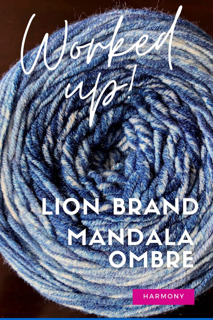 the lion brand mandala ombre yarn is blue and grey with white stripes