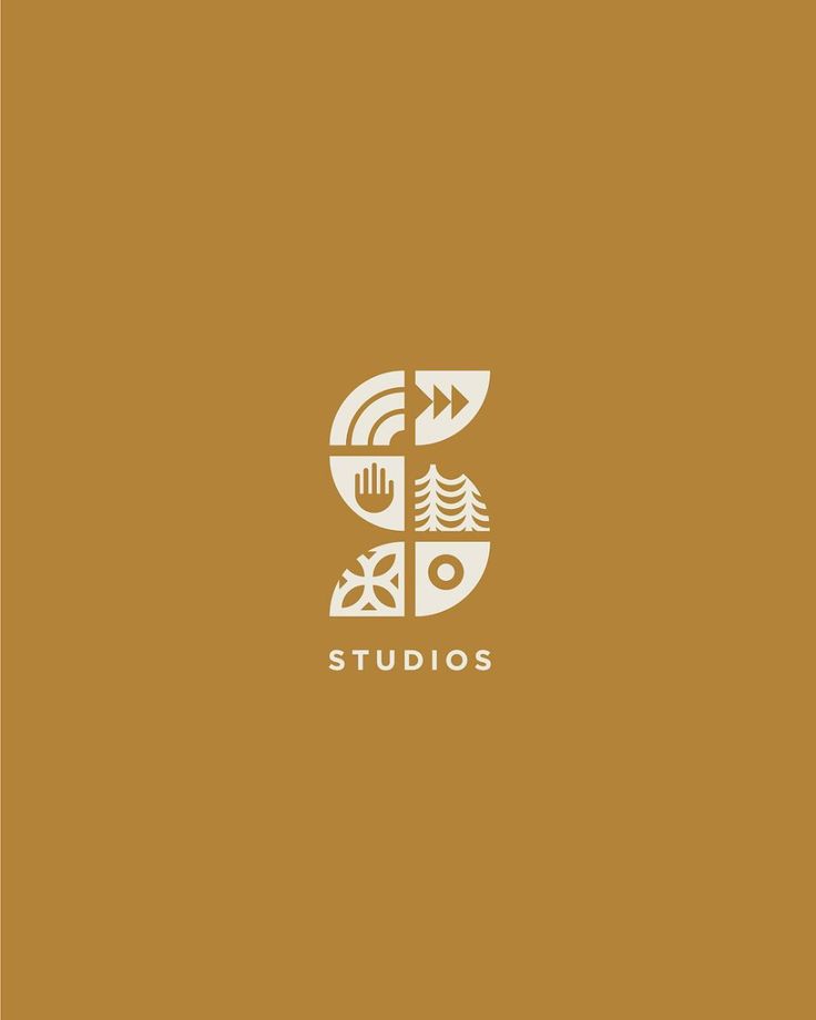 the logo for studio, which is designed in gold and white with an arrow on it