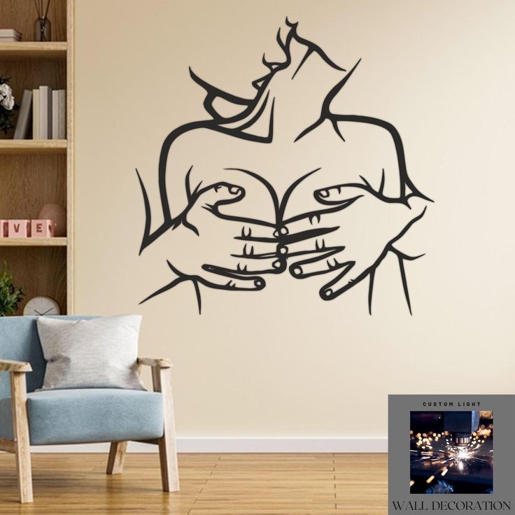 a wall decal with two hands holding each other in front of a bookshelf