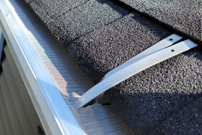 a pair of scissors laying on top of a roof