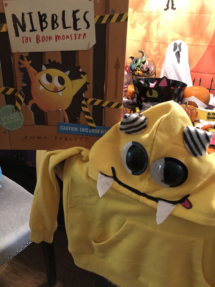 there is a yellow monster costume on display