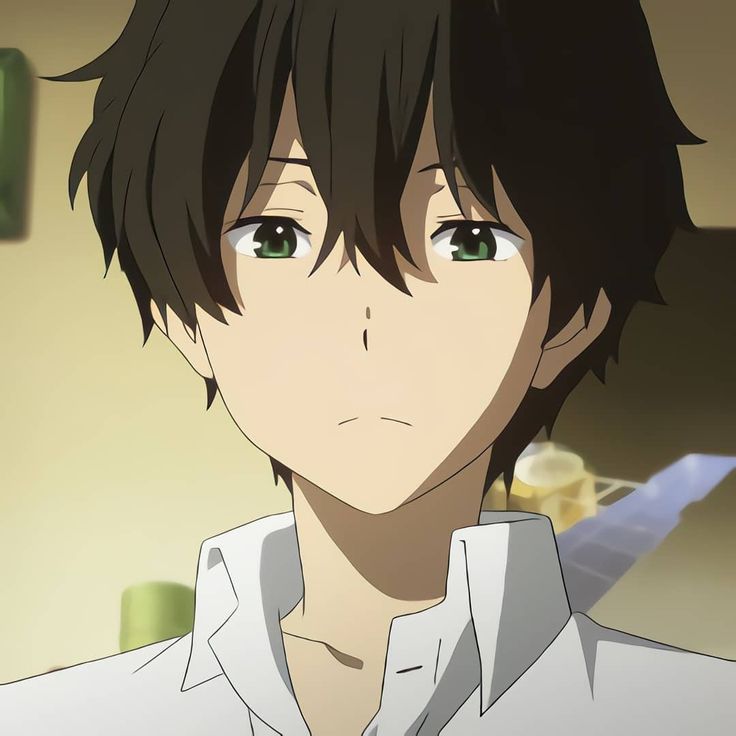 a young man with black hair and green eyes staring at the camera, in an anime scene