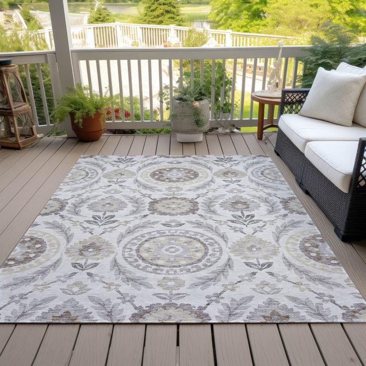 an outdoor area rug on a deck with furniture