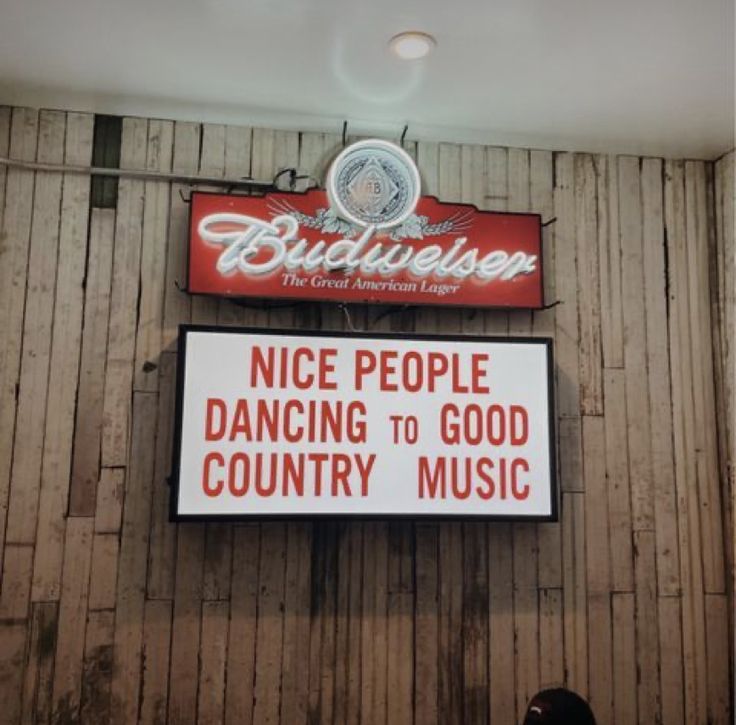 there is a sign that says nice people dancing to good country music on the wall