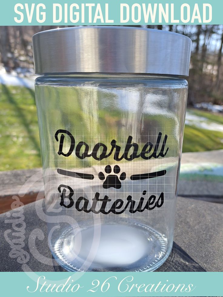 a clear glass with the words dorbbell batteries on it and an image of a dog's paw