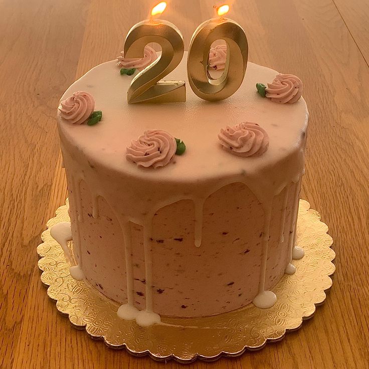 a birthday cake with two candles on it