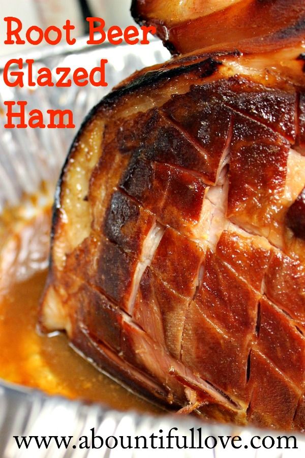 a close up of food on a plate with text overlay that reads root beer glazed ham